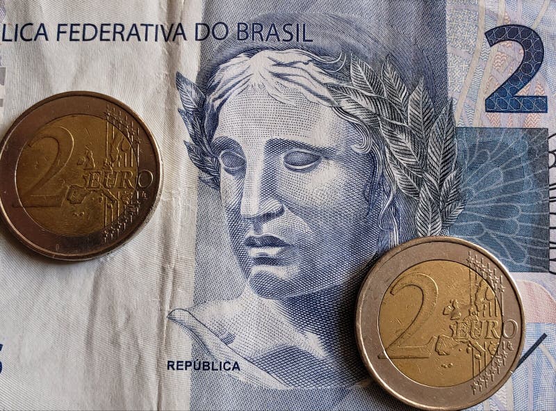 Approach To Brazilian Banknote of Two Reais and Euro Coins, Background ...