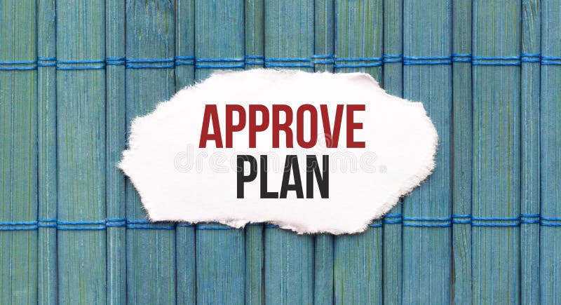 Approve plan text on the piece of paper on the green wood background stock photography