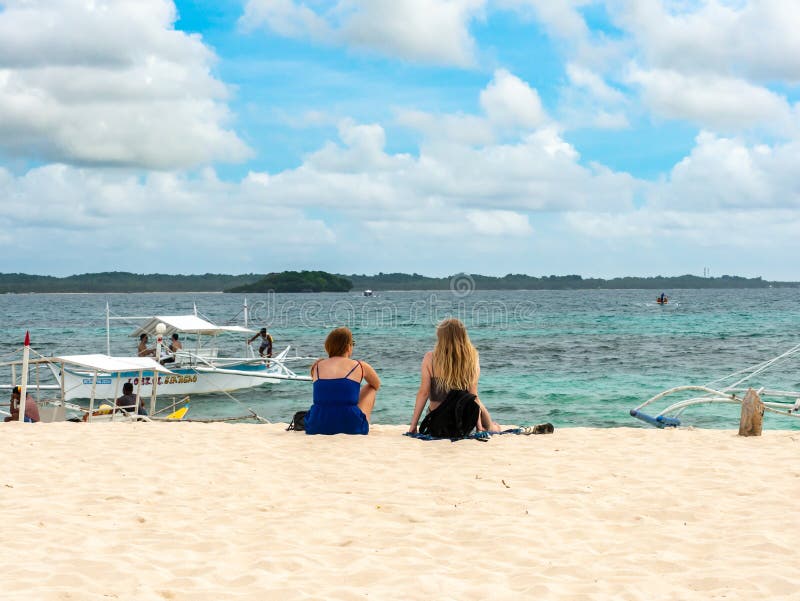 Travelers Who Relax On The Cloud 9 Beach, Siargao 