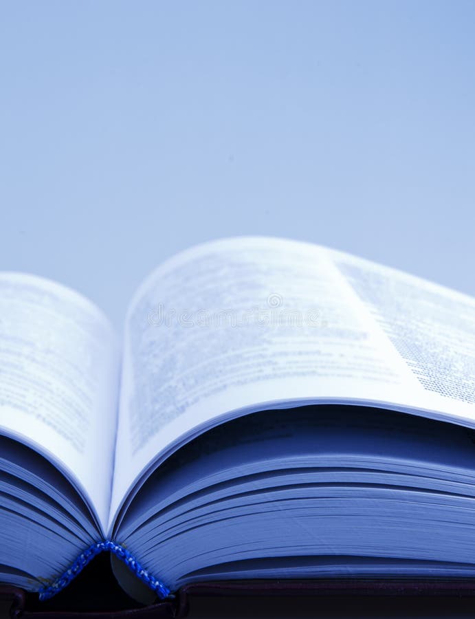 Open book with blurred pages (in blue tones). Open book with blurred pages (in blue tones)