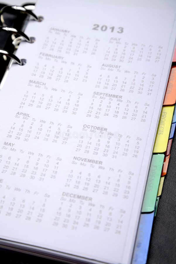 Apra l'ordine del giorno con la pagina del calendario immagini stock Apra l'ordine del giorno con la pagina del calendario immagini stock