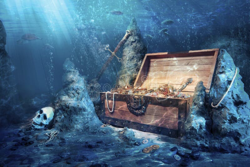 Apra la cassa di tesoro con il underwater luminoso dell'oro