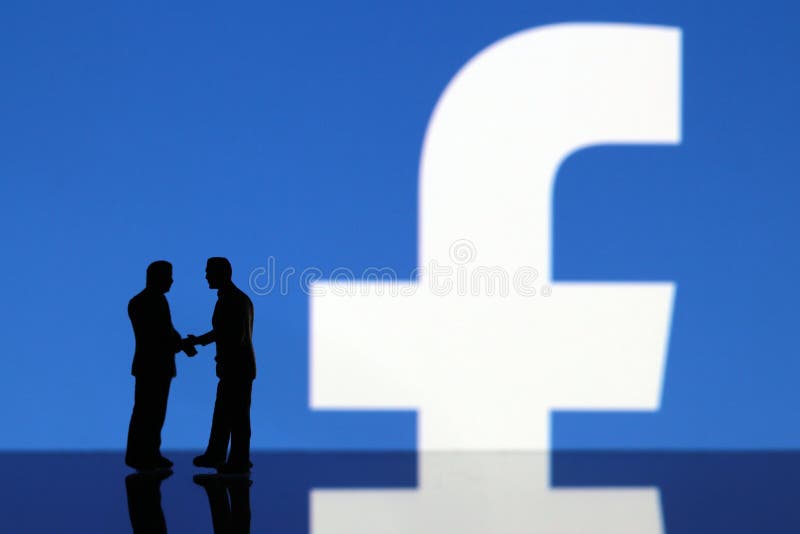 Apretón de manos con el logotipo de Facebook