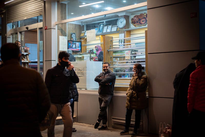 People staying in Queues in front of shops to buy food befor the 2-Day curfew. It is 23.00 and in 1 Hour the curfew begins. People staying in Queues in front of shops to buy food befor the 2-Day curfew. It is 23.00 and in 1 Hour the curfew begins.