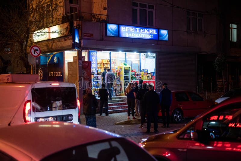 People staying in Queues in front of shops to buy food befor the 2-Day curfew. It is 23.00 and in 1 Hour the curfew begins. People staying in Queues in front of shops to buy food befor the 2-Day curfew. It is 23.00 and in 1 Hour the curfew begins.