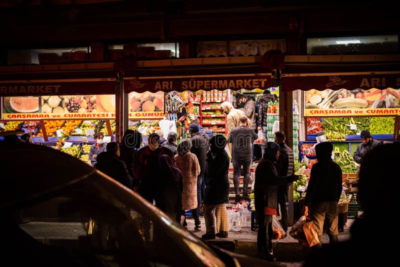 People staying in Queues in front of shops to buy food befor the 2-Day curfew. It is 23.00 and in 1 Hour the curfew begins. People staying in Queues in front of shops to buy food befor the 2-Day curfew. It is 23.00 and in 1 Hour the curfew begins.
