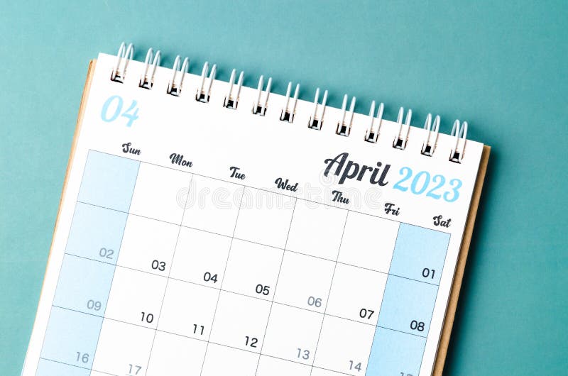 A April 2023 calendar desk for the organizer to plan and reminder isolated on blue background