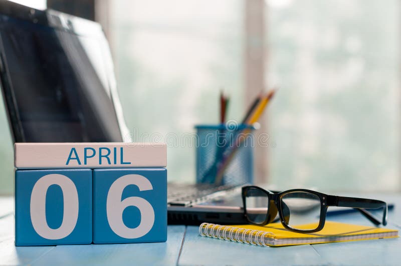 April 6th. Day 6 of month, calendar on business office background, workplace with laptop and glasses. Spring time, empty royalty free stock photography April 6th. Day 6 of month, calendar on business office background, workplace with laptop and glasses. Spring time, empty royalty free stock photography