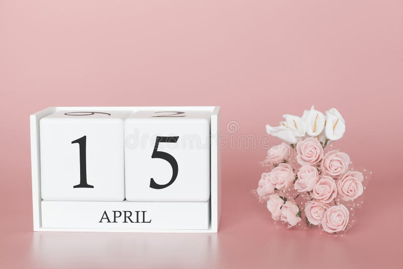 April 15th. Day 15 of month. Calendar cube on modern pink background, concept of bussines and an importent event stock photos