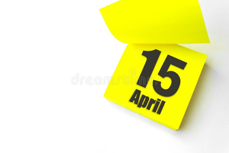 April 15th. Day 15 of month, Calendar date. Close-Up Blank Yellow paper reminder sticky note on White Background. Spring month royalty free stock photos