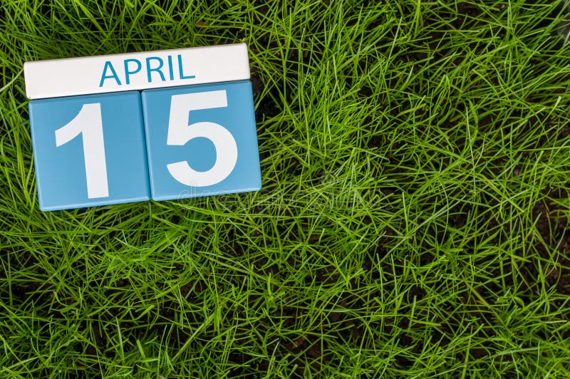 April 15th. Day 15 of month, calendar on football green grass background. Spring time, empty space for text royalty free stock image