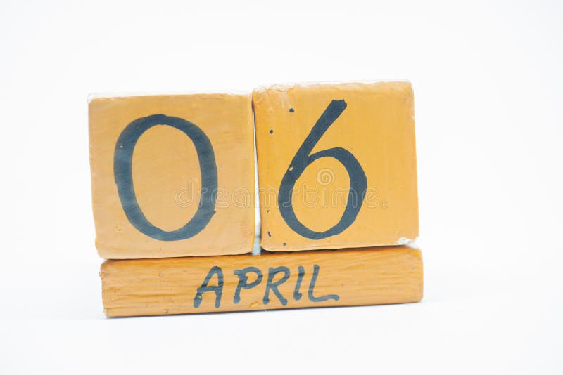 april 6th. Day 6 of month, handmade wood calendar isolated on white background. spring month, day of the year concept