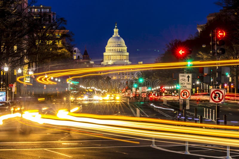 APRIL 11, 2018 WASHINGTON D.C. - Pennsylvania Ave to US Capitol with Streaked lights going towards US Capitol in Washington DC. during rush hour PM. APRIL 11, 2018 WASHINGTON D.C. - Pennsylvania Ave to US Capitol with Streaked lights going towards US Capitol in Washington DC. during rush hour PM