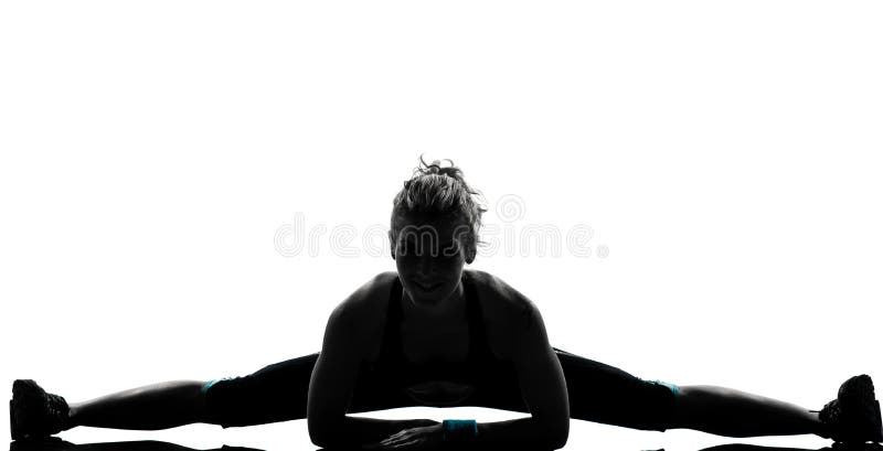 Aptidão do exercício da mulher que estica splits imagens de stock royalty free Aptidão do exercício da mulher que estica splits imagens de stock royalty free