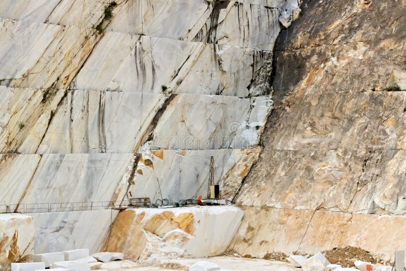 A quarry of white marble. The precious white Carrara marble has been extracted from the Alpi Apuane quarries since Roman times royalty free stock photo A quarry of white marble. The precious white Carrara marble has been extracted from the Alpi Apuane quarries since Roman times royalty free stock photo