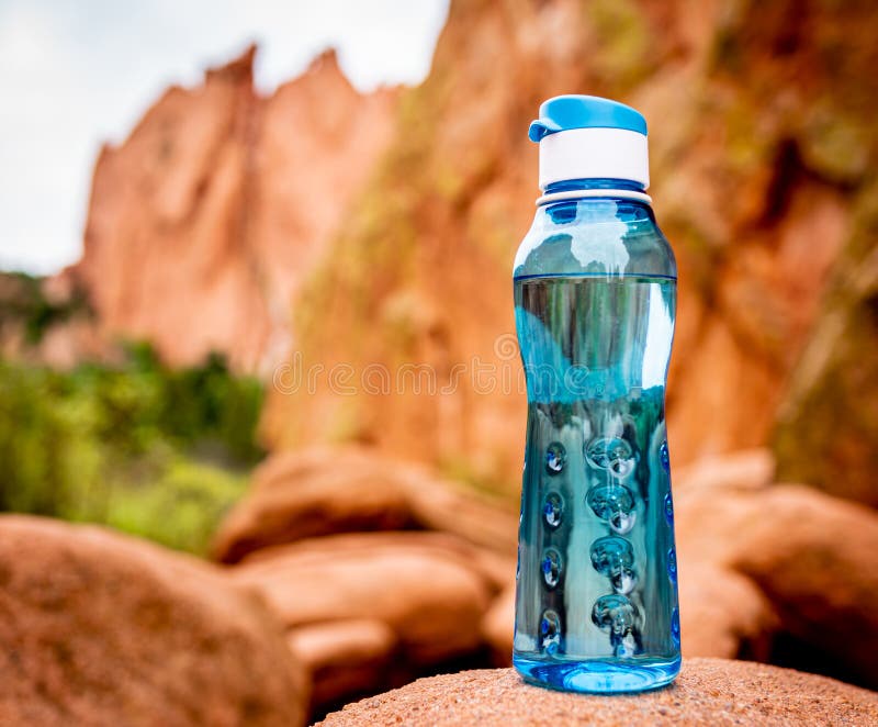 Aqua Blue Fitness Water Bottle with Mountains in Background