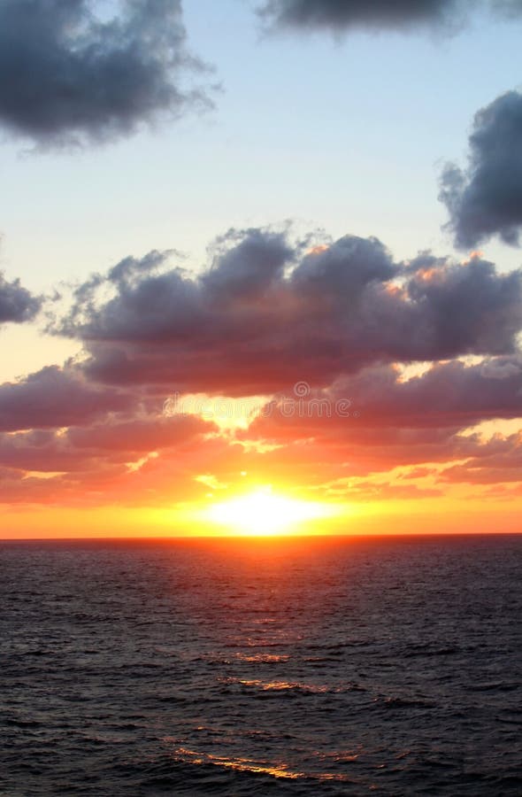 Aqua skies and yellowish hues of clouds in Caribbean ocean