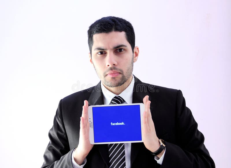Arab business man with facebook stock photography Arab business man with facebook stock photography