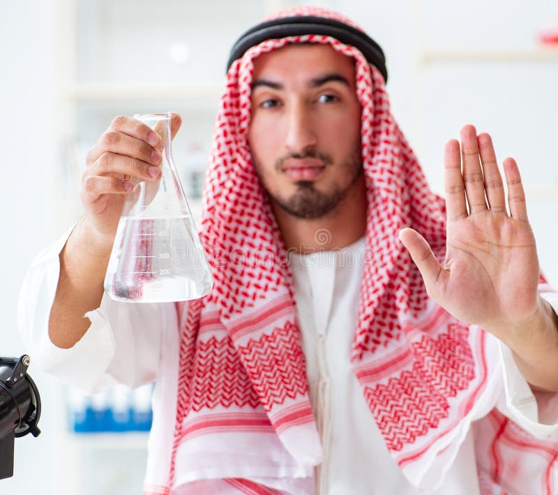 Arab chemist checking the quality of drinking water stock photos