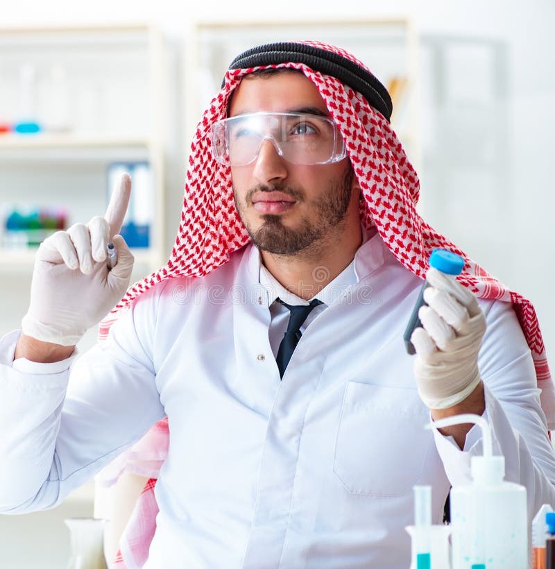 Arab chemist scientist testing quality of oil petrol royalty free stock photography