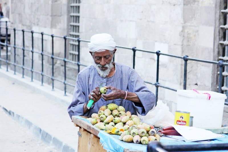 Arab egyptian selling prickly pears in egypt