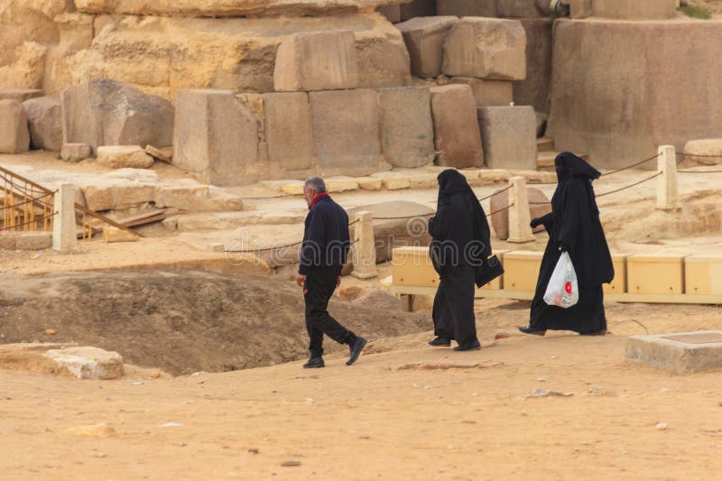 Arab With His Two Wives Walking Near Great Pyramids Of Giza In Cairo Egypt Editorial Stock