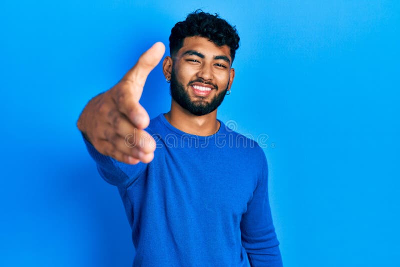 Arab Man with Beard Wearing Casual Blue Sweater Smiling Friendly