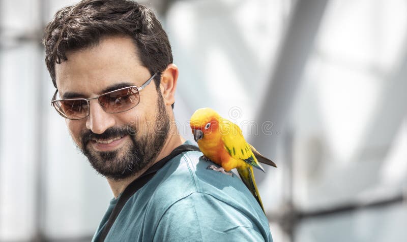 Arab Man with a Bird Sitting on His Shoulder Stock Photo - Image of ...
