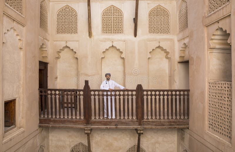 Arab man in traditional omani outfit in an old castle