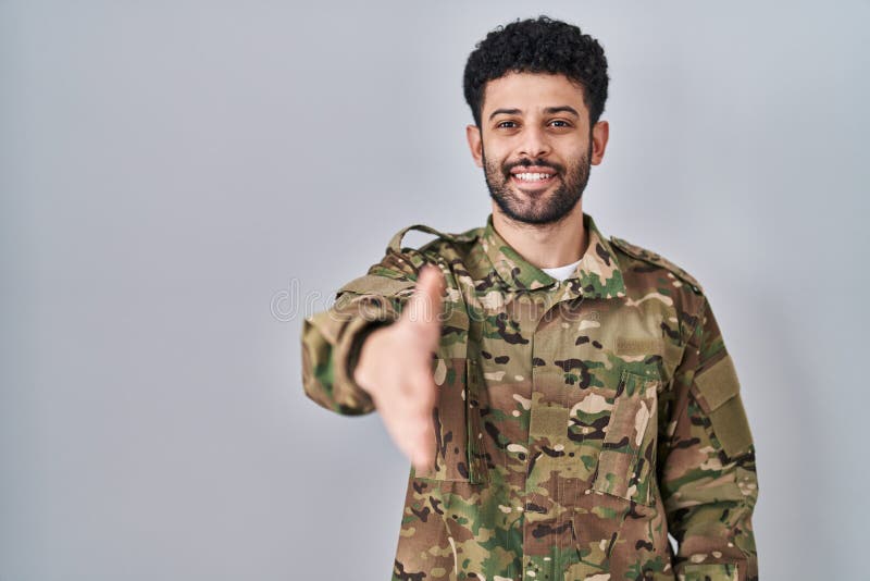 Arab Man Wearing Camouflage Army Uniform Smiling Friendly Offering
