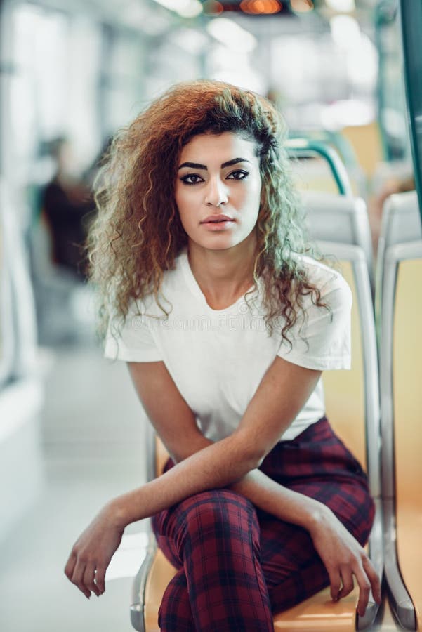 Arab woman inside metro train. Arab girl in casual clothes. stock image Arab woman inside metro train. Arab girl in casual clothes. stock image