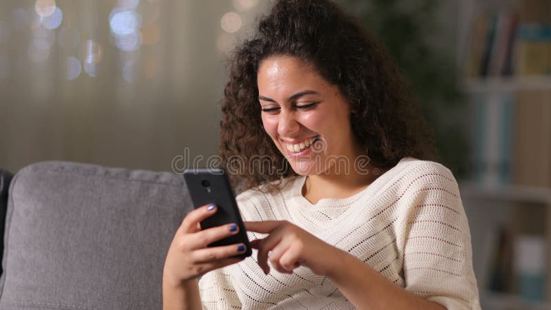 Arab woman using smart phone at home