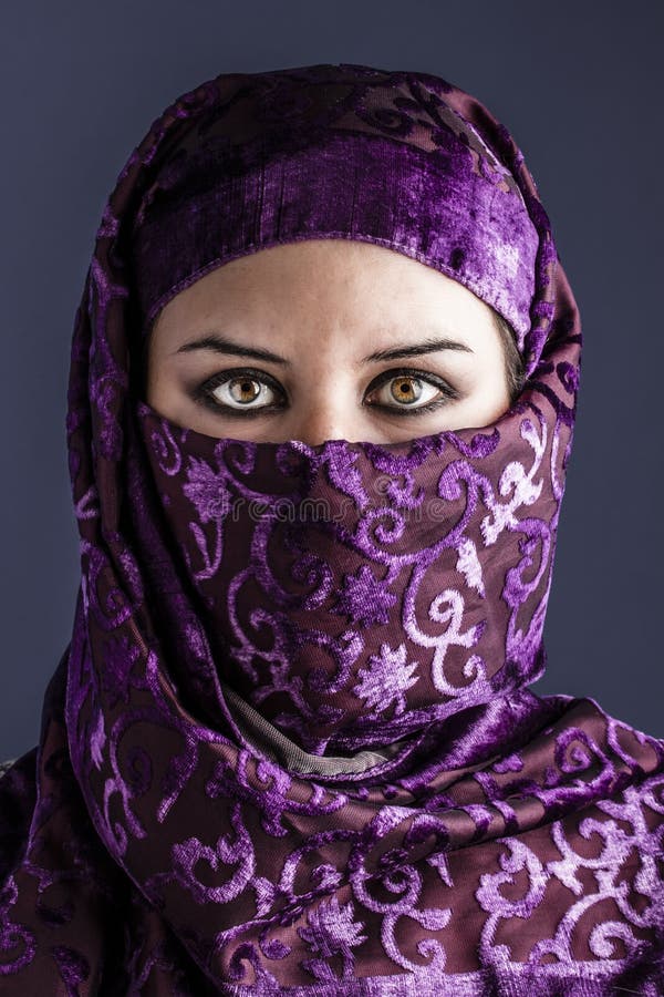 Arab women with traditional veil, eyes intense, mystical beauty