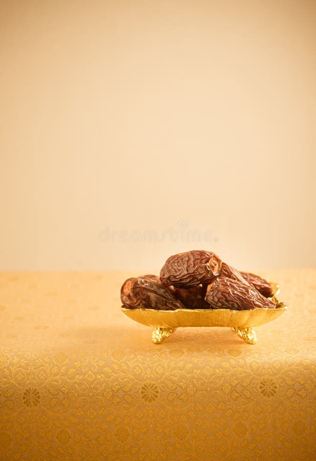 Arabian dates in golden plate