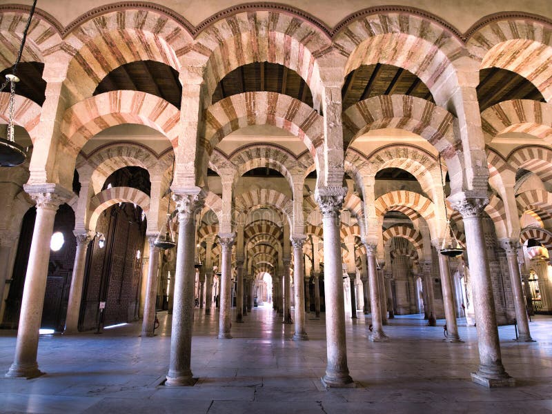 Arabic islamic style architecture sequence of arches in the mosque of cordova, spain royalty free stock photography