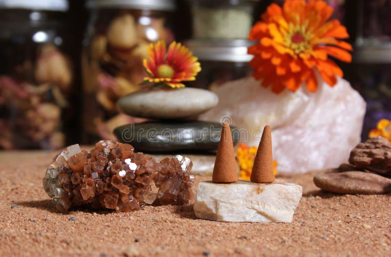 Aragonite Crystal with Incense Cones on Australian Red Sand Stock Photo