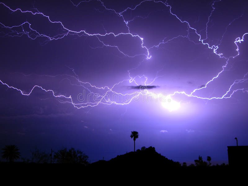 Spider lightning over a hilltop house during a freak storm in Phoenix. Spider lightning over a hilltop house during a freak storm in Phoenix