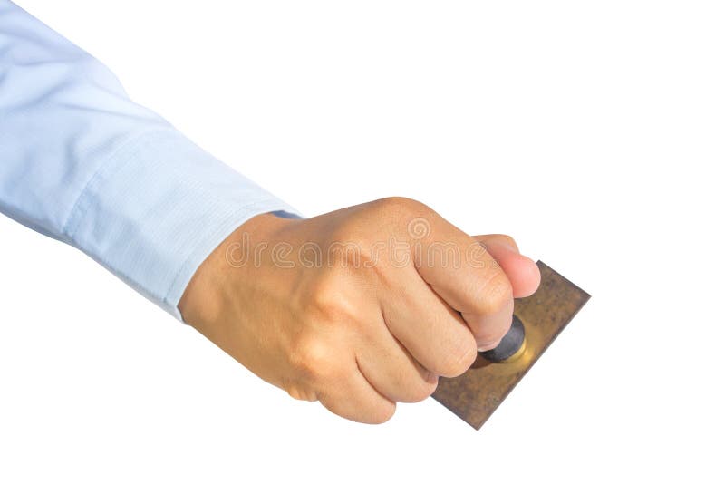 Hand van een werknemer die een oude rubberen stempel vasthoudt royalty-vrije stock foto's
