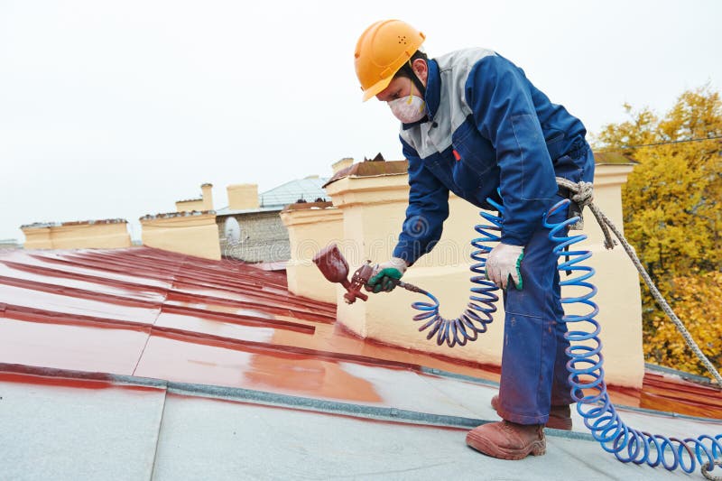 Arbetare för byggmästareroofermålare arkivfoto Arbetare för byggmästareroofermålare arkivfoto