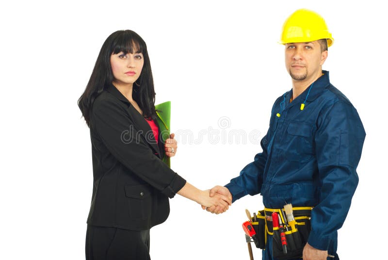 Business woman and constructor worker make a deal and shaking their hands isolated on white background. Business woman and constructor worker make a deal and shaking their hands isolated on white background