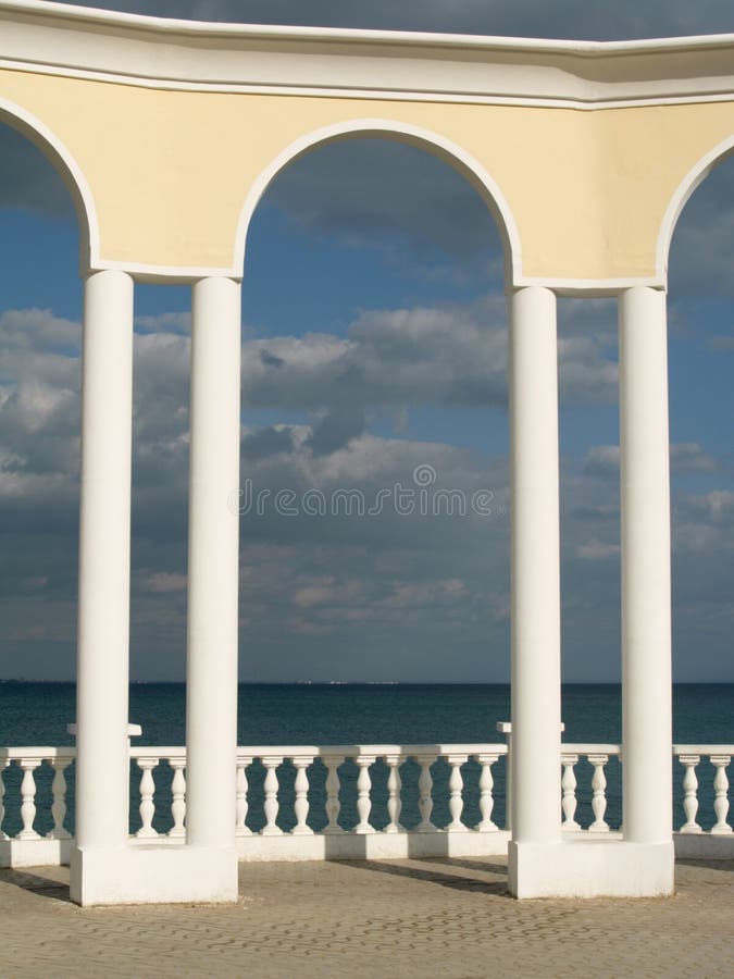 Arc, balustrade and sea