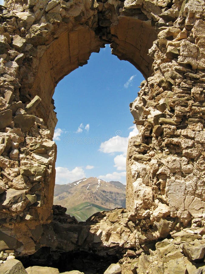 The arc in ruins of Qaleh Dokhtar , Sassanid fire temple  on top of peak in Alborz mountains , Iran