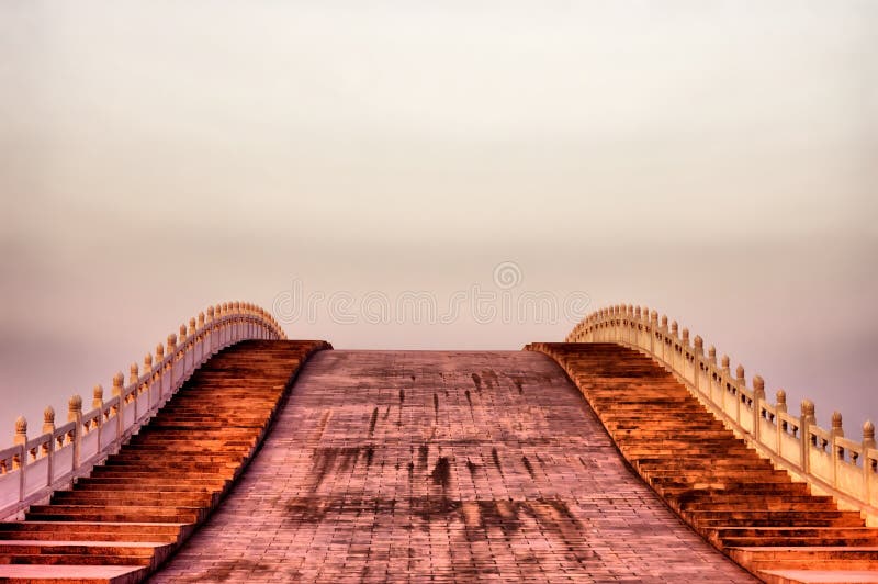 Arch bridge at sunset time