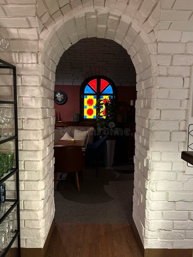 Arch and White Brick Wall in a Restaurant Stock Photo Image of iron