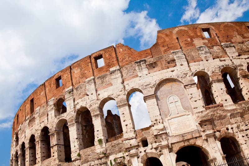 Arched facade of ancient Colosseum in Rome