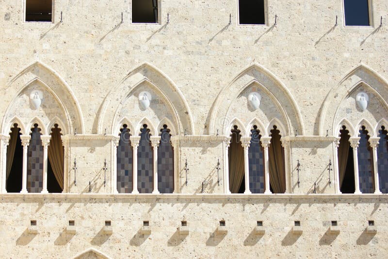 Arched windows in Sienna Italy