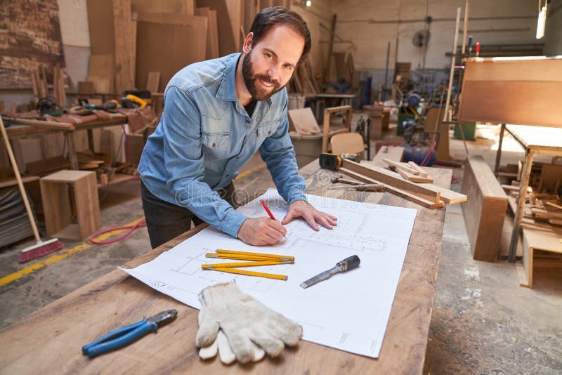 Architect with architectural drawing during project planning royalty free stock images