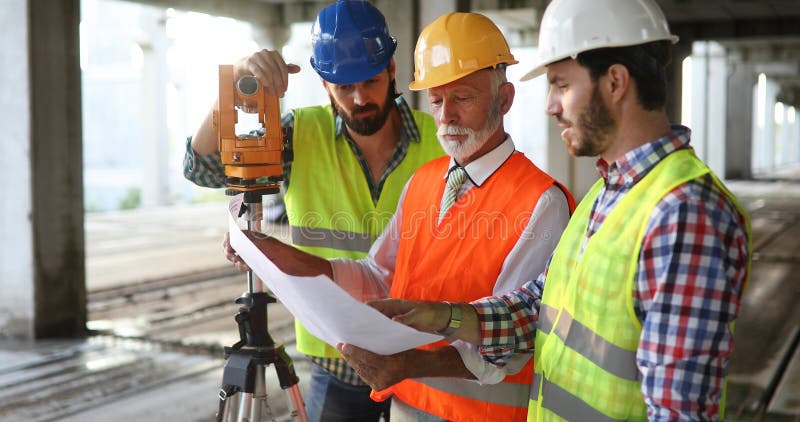 Architect and construction engineer or surveyor discussion plans and blueprints royalty free stock photos Architect and construction engineer or surveyor discussion plans and blueprints royalty free stock photos