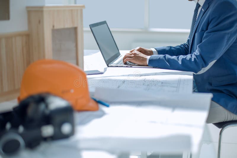 Architect designer using laptop in his office. stock photos