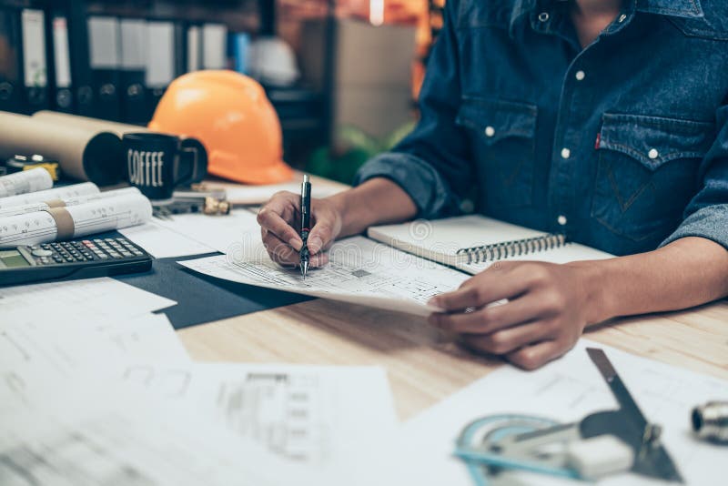 Architect Engineer Use Pen Drawing Design Working on Blueprint. House